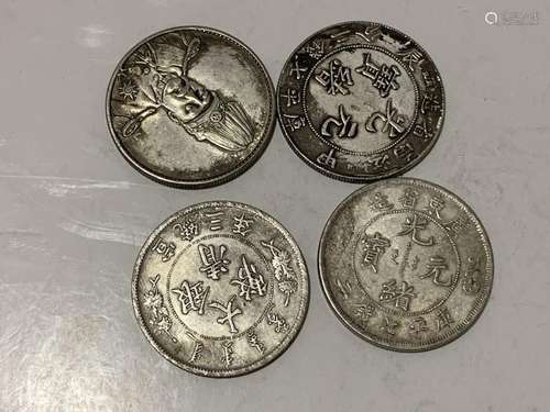 Four Chinese Coins