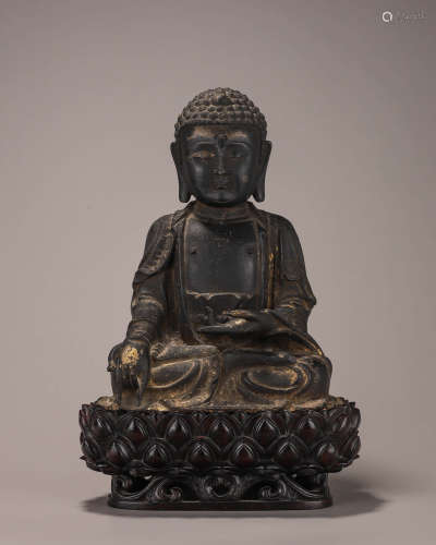 A copper buddha statue