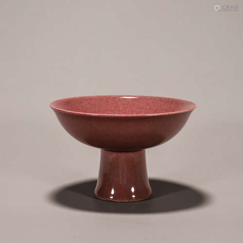 A red glazed porcelain cup