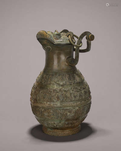 A dragon patterned bronze loop-handled pot