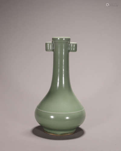 A celadon glazed porcelain double-eared vase