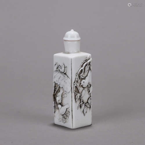 A bird carved porcelain snuff bottle
