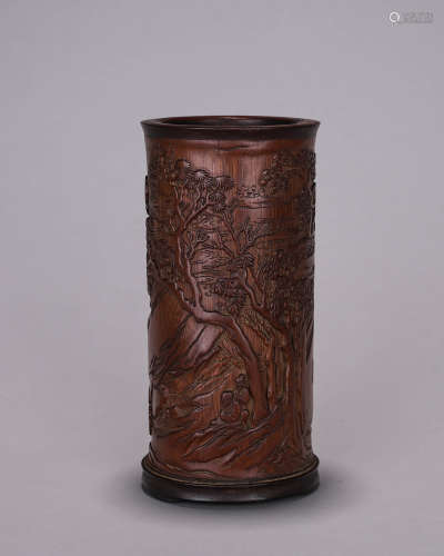 A landscape and figure carved bamboo brush pot