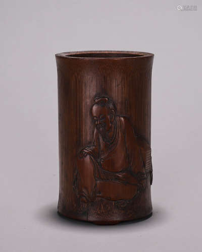 A figure carved bamboo brush pot