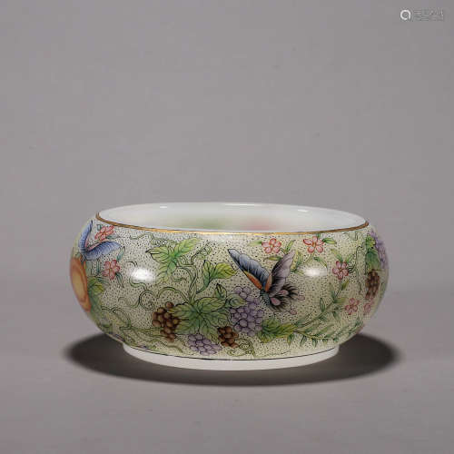 A flower and butterfly patterned glass bowl