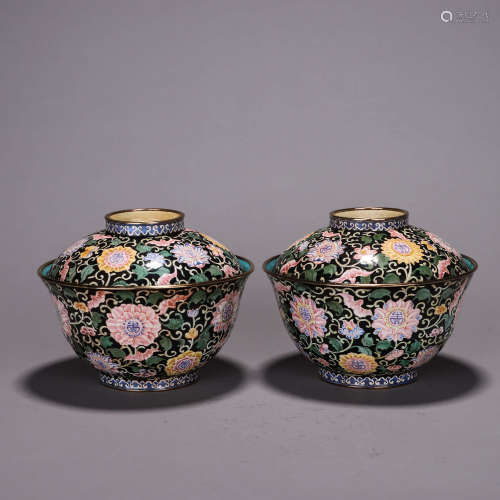 A pair of copper enamel covered bowls