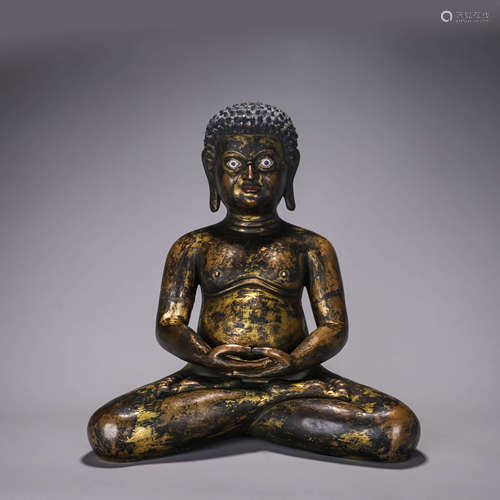 A copper buddha statue