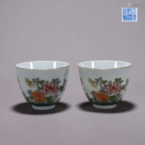 A pair of famille rose flower inscribed porcelain cups