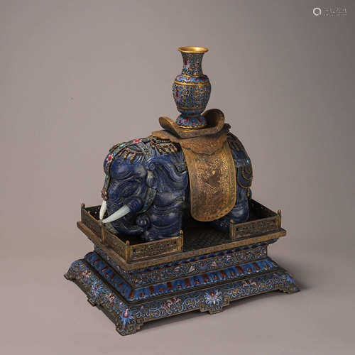 A lasurite elephant ornament with gilding copper enamel pede...