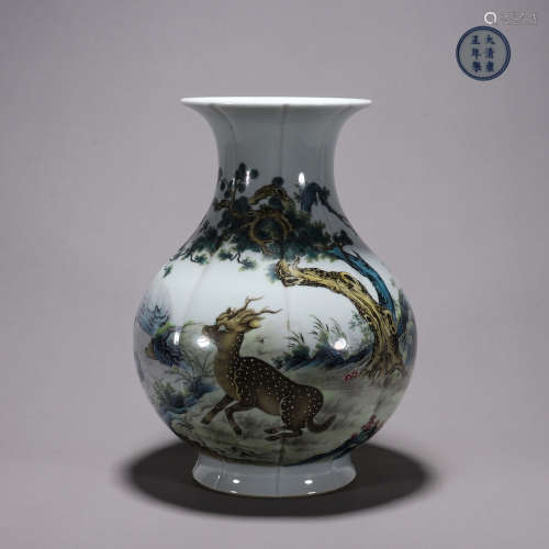 A famille rose landscape and beast porcelain zun