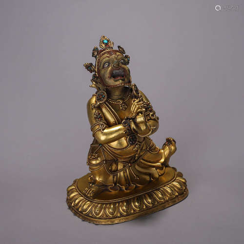 A gilding copper buddha statue