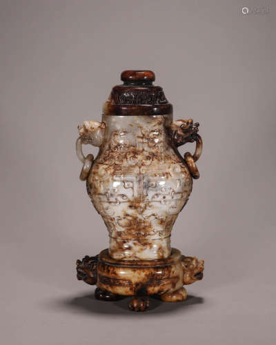 A taotie pattered Hetian jade dragon head vase