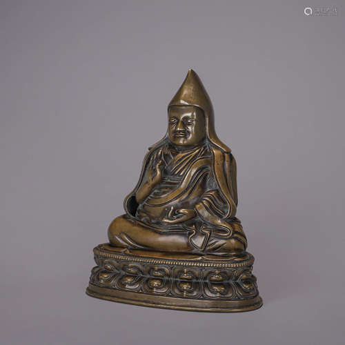 A copper buddha statue