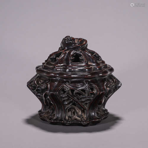 A red sandalwood hollowed out incense burner