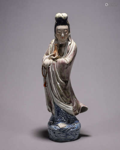 A blue and white iron red porcelain Guanyin statuette