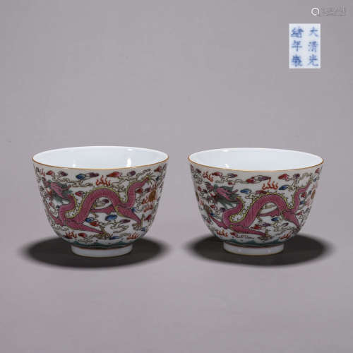 A pair of famille rose cloud and dragon porcelain bowls