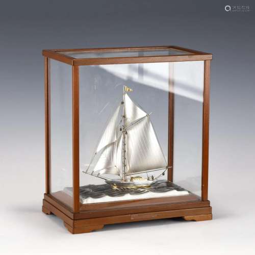 SILVER SAILBOAT IN DISPLAY CASE