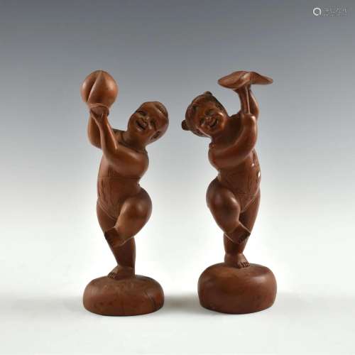 BOXWOOD STATUE OF A BOY AND A GIRL