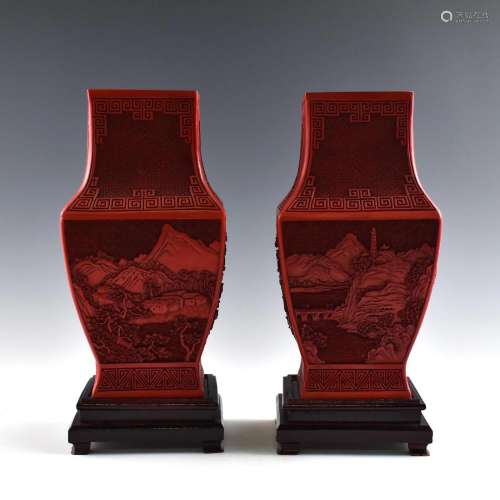 A PAIR OF CARVED CINNABAR VASES WITH BASES