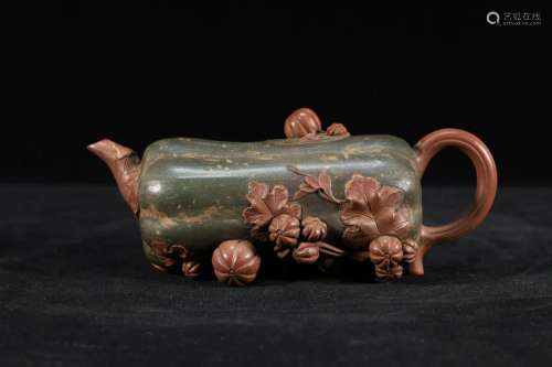 A Fine Yixing Clay Teapot With Eight Immortals Pattern
