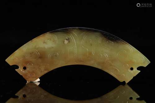 A Delicate Carved Green Jade Pendant