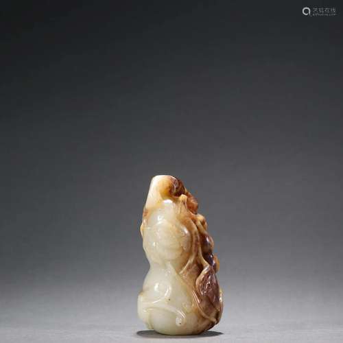 A Delicate Carved Jade Gourd Pendant