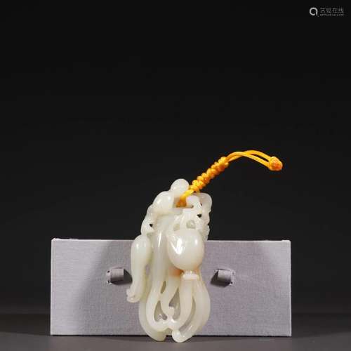 A Carved White Jade Chayote Pendant