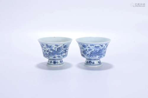 A Pair Of Blue And White Cups