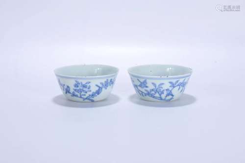 A Pair Of Blue And White Cups