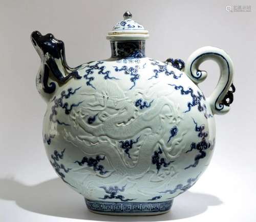 A BLUE AND WHITE CARVED CELADON MOONFLASK WITH DESIGN