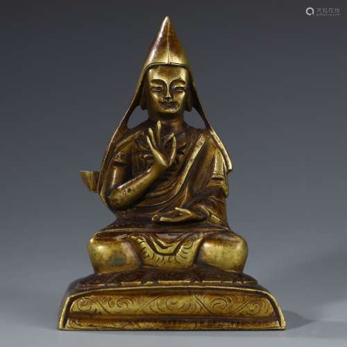 Ancient bronze-gilded guru statue
