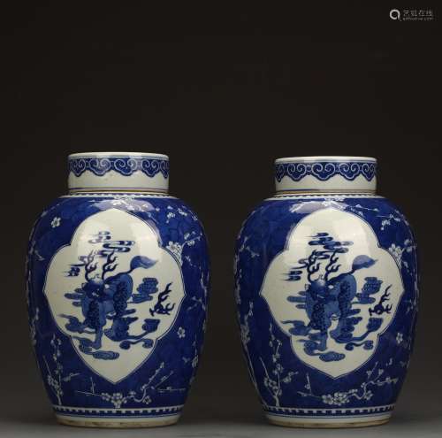 A pair of blue and white beast pots