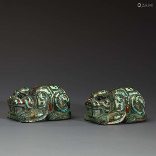 A pair of ancient bronze inlaid turquoise agate beasts