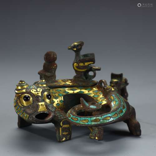 Ancient bronze beast-shaped ornament inlaid with gold and si...