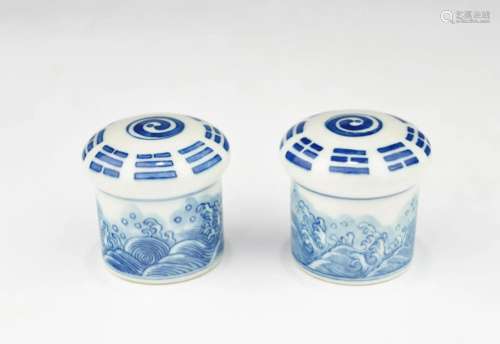 A PAIR OF QING DYNASTY BLUE AND WHITE SCROLL ENDS