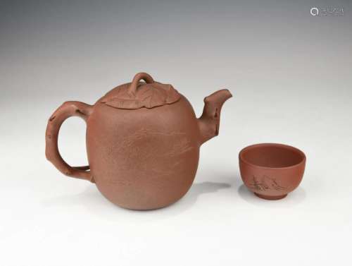 A CHINESE ZISHA TEAPOT AND A CUP