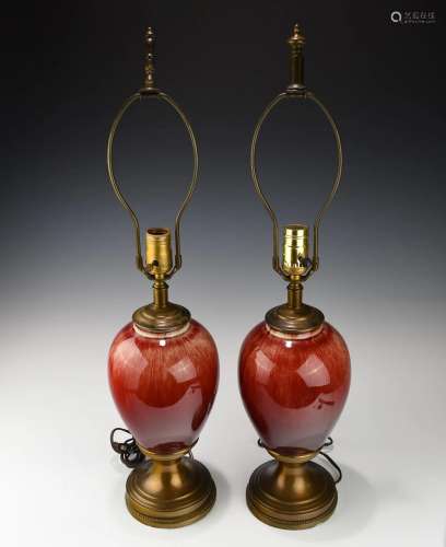 A PAIR OF COPPER RED PORCELAIN VASE TABLE LAMPS
