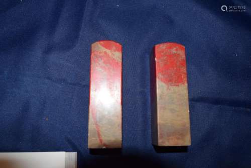 a pair of chicken blood stone seal