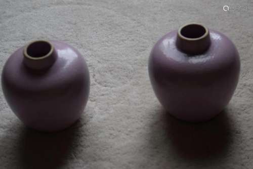 a pair small pink jars