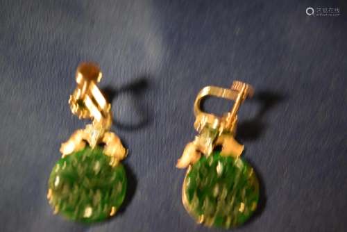 pair of jade and diamonds earrings.