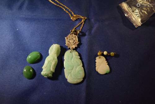 a group of jade items.