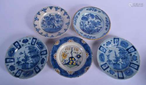 FIVE 18TH CENTURY DELFT BLUE AND WHITE PLATES in various des...