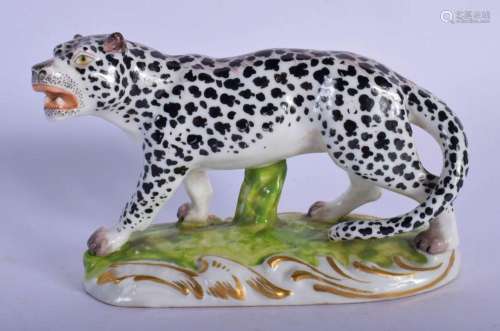 A 19TH CENTURY EUROPEAN PORCELAIN FIGURE OF A SPOTTED BLACK ...