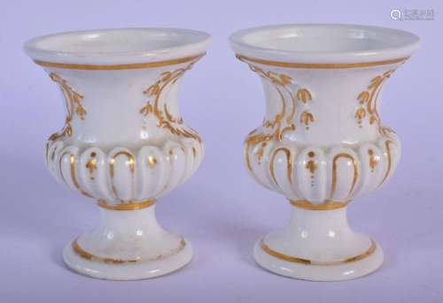 19TH C. MEISSEN PAIR OF URNS WITH MOULED CARTOUCHES WITH GIL...