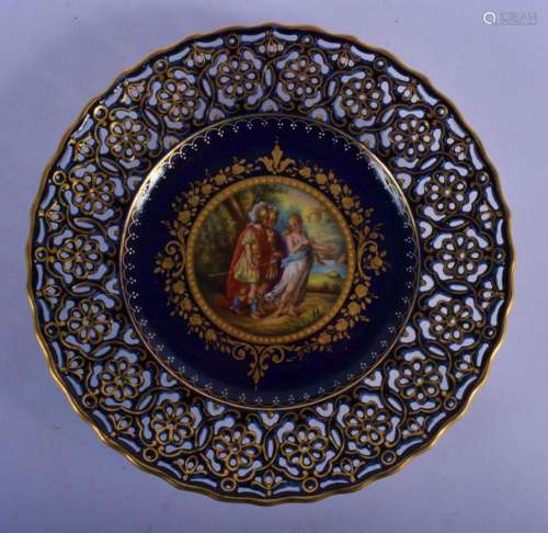 AN ANTIQUE VIENNA PORCELAIN RETICULATED PLATE painted with f...