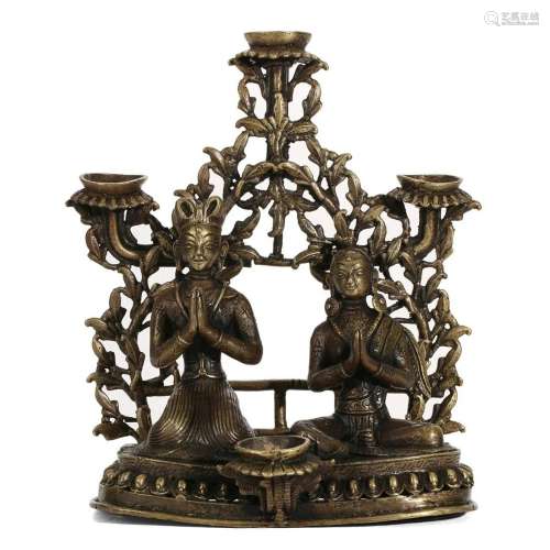 A GILT-BRONZE CANDLE HOLDER