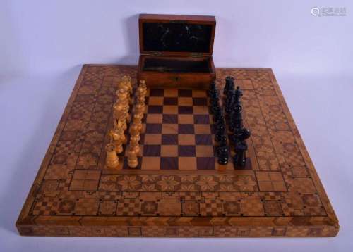 AN ANTIQUE BOXWOOD AND EBONY CHESS SET with similar parquetr...
