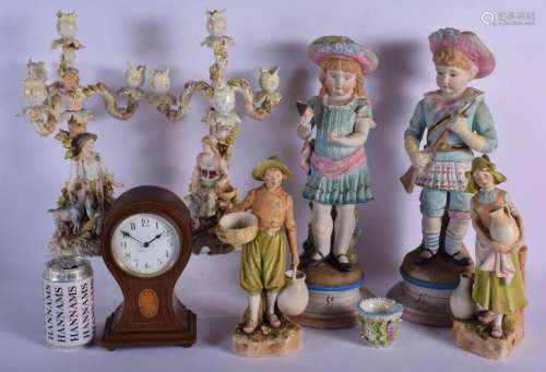 A PAIR OF ROYAL DUX FIGURES together with a clock, bisque fi...