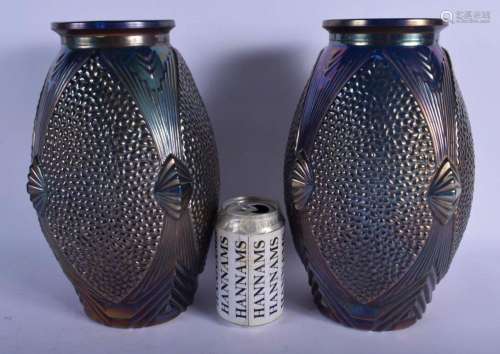 A PAIR OF CARNIVAL GLASS VASES decorated with shell motifs. ...