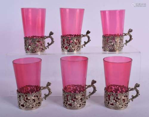 A SET OF SIX ANTQUE SILVER AND CRANBERRY GLASSES by William ...
